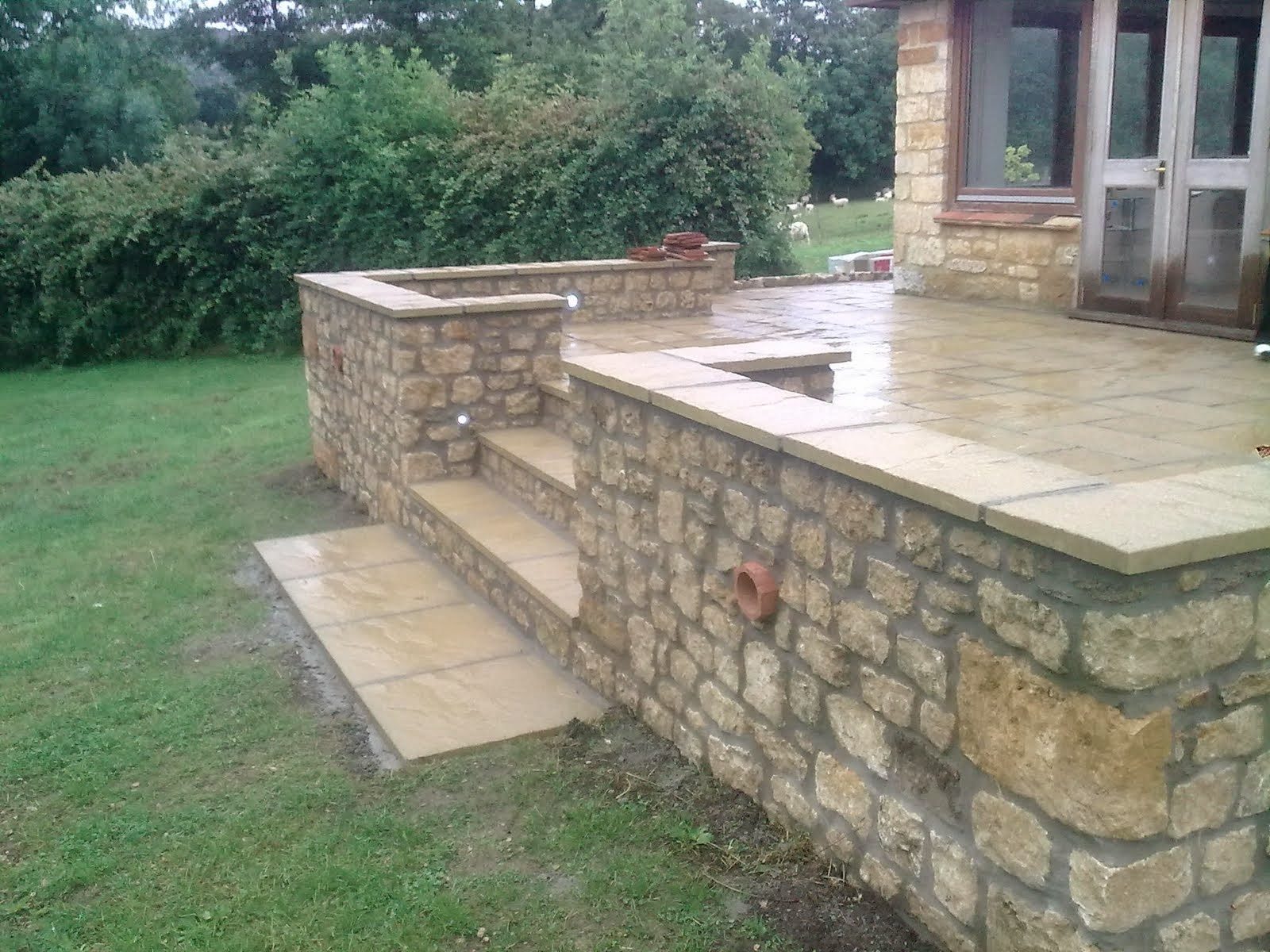 Stone steps and retaining walls to a new sandstone patio, West Dorset